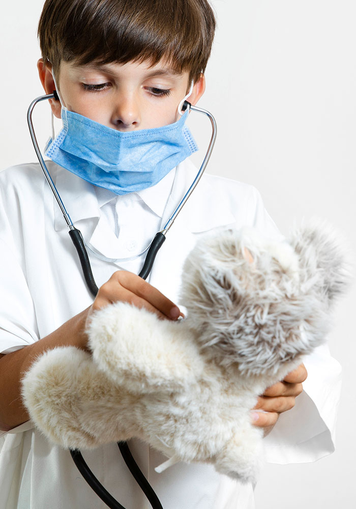 young-child-with-stethoscope-teddy-bear